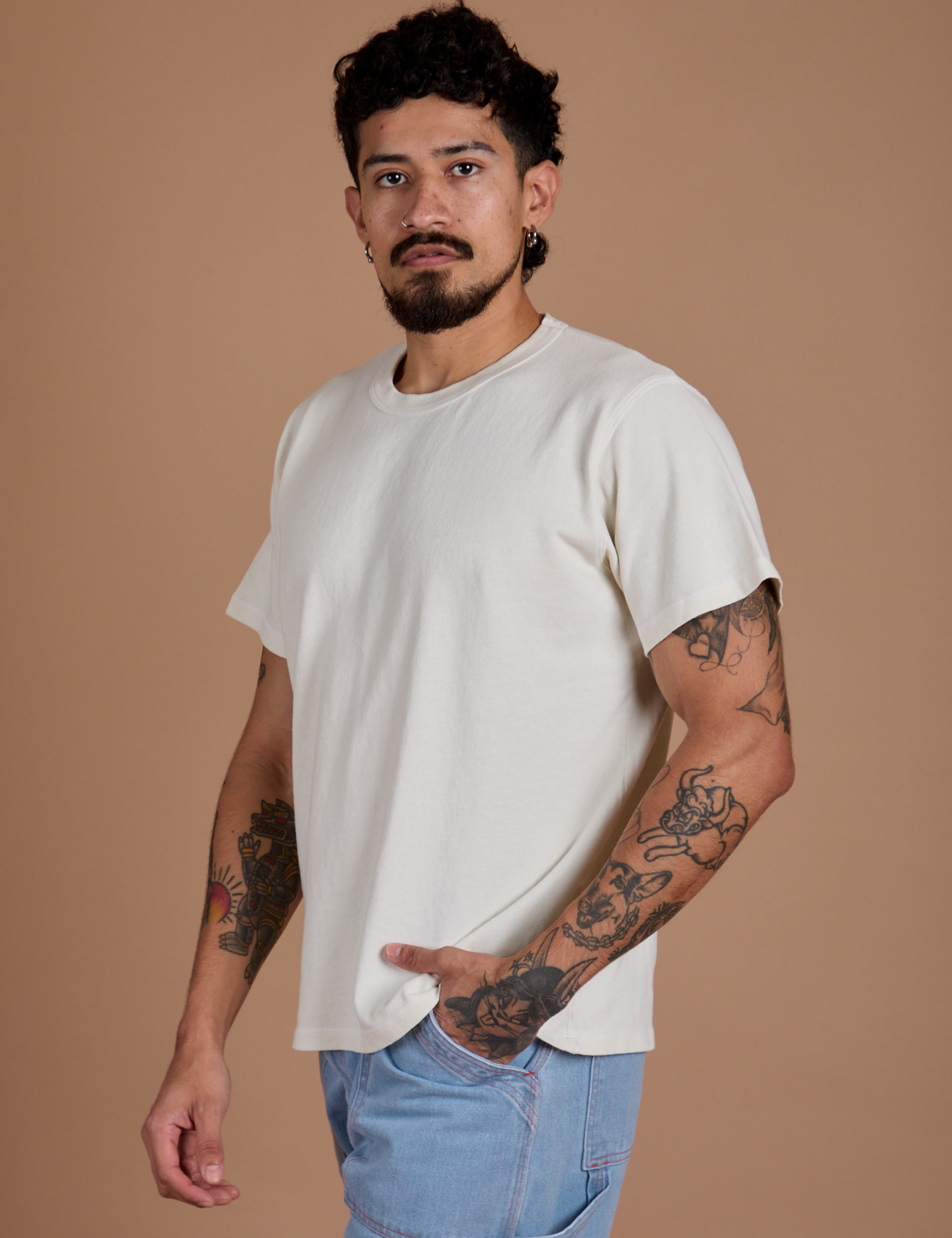 Angled front view of Burly Tee in Vintage Tee White on Jesse