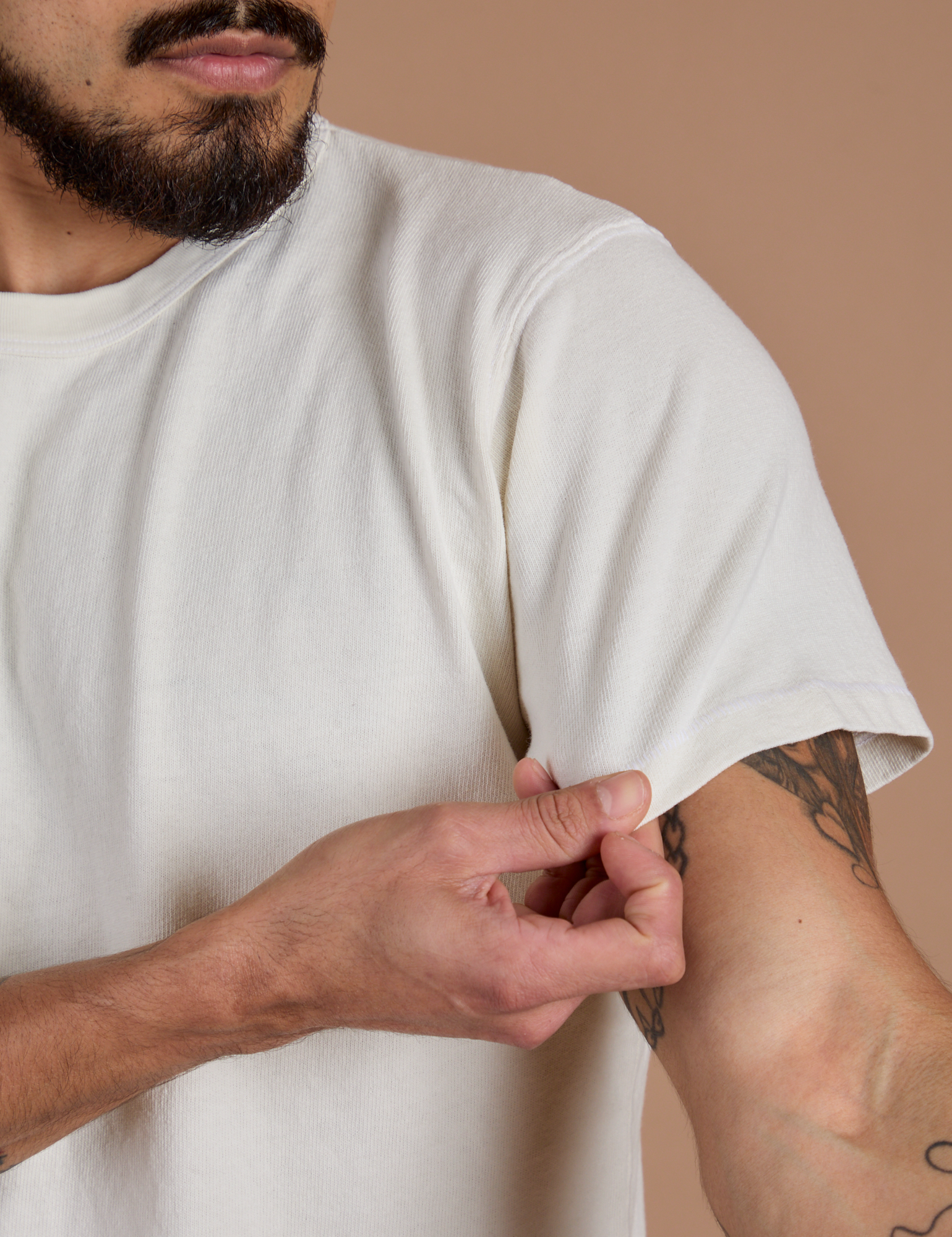 Close up of Burly Tee in Vintage Tee White sleeve on Jesse