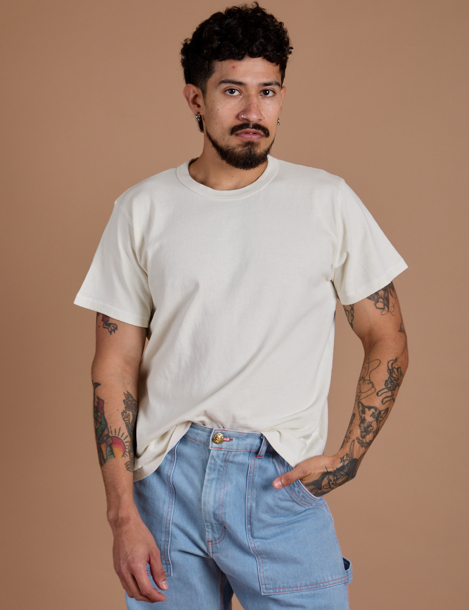 Jesse is wearing Burly Tee in Vintage Tee White