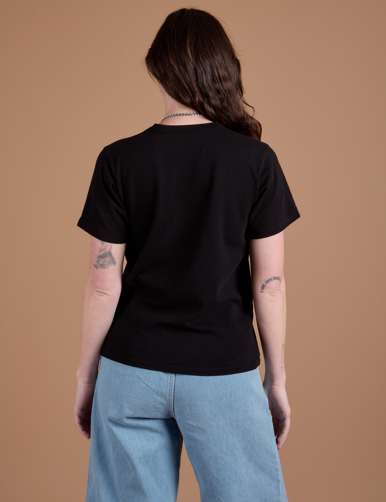 Burly Tee in Basic Black back view on Alex