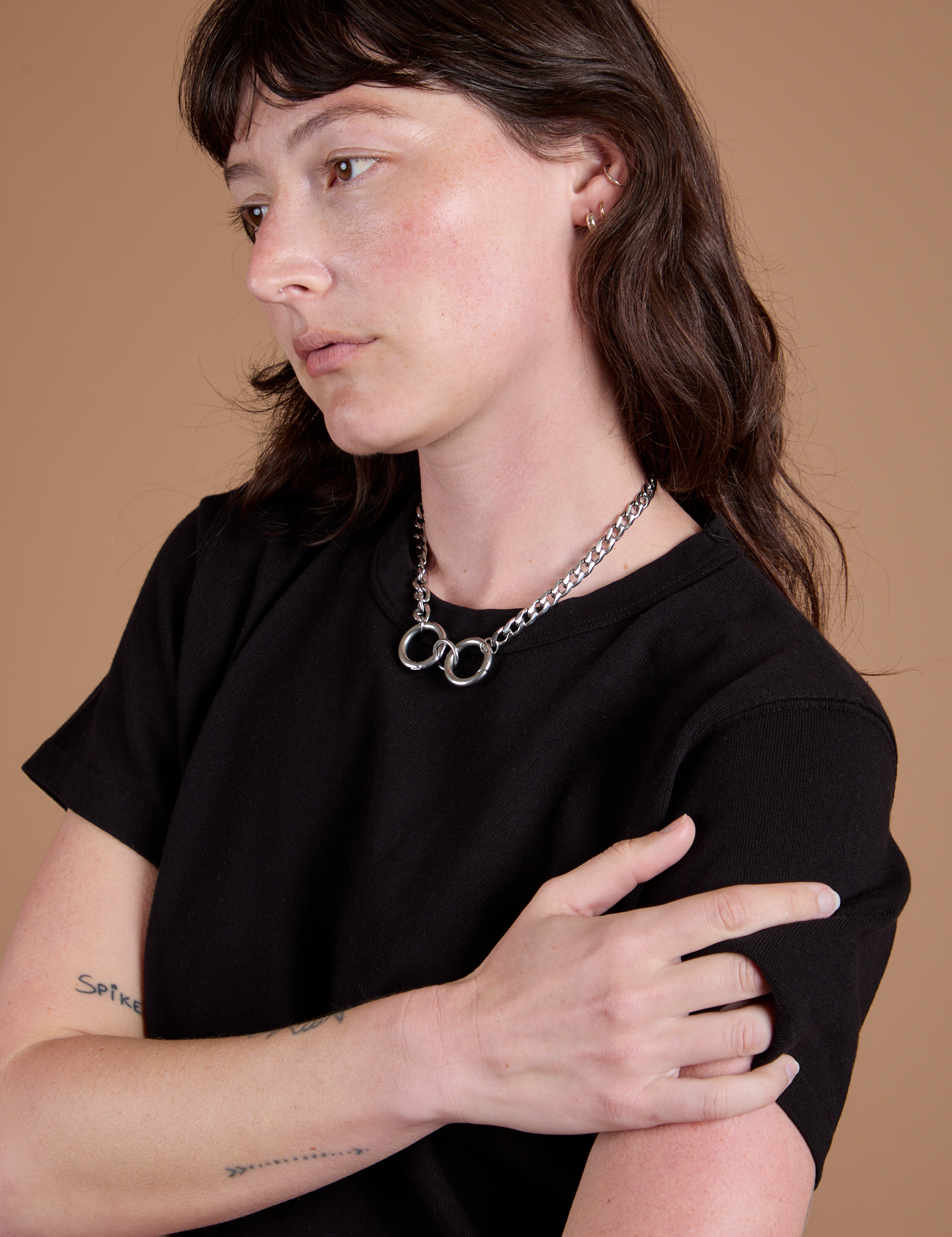 Angled front view close up of Burly Tee in Basic Black on Alex