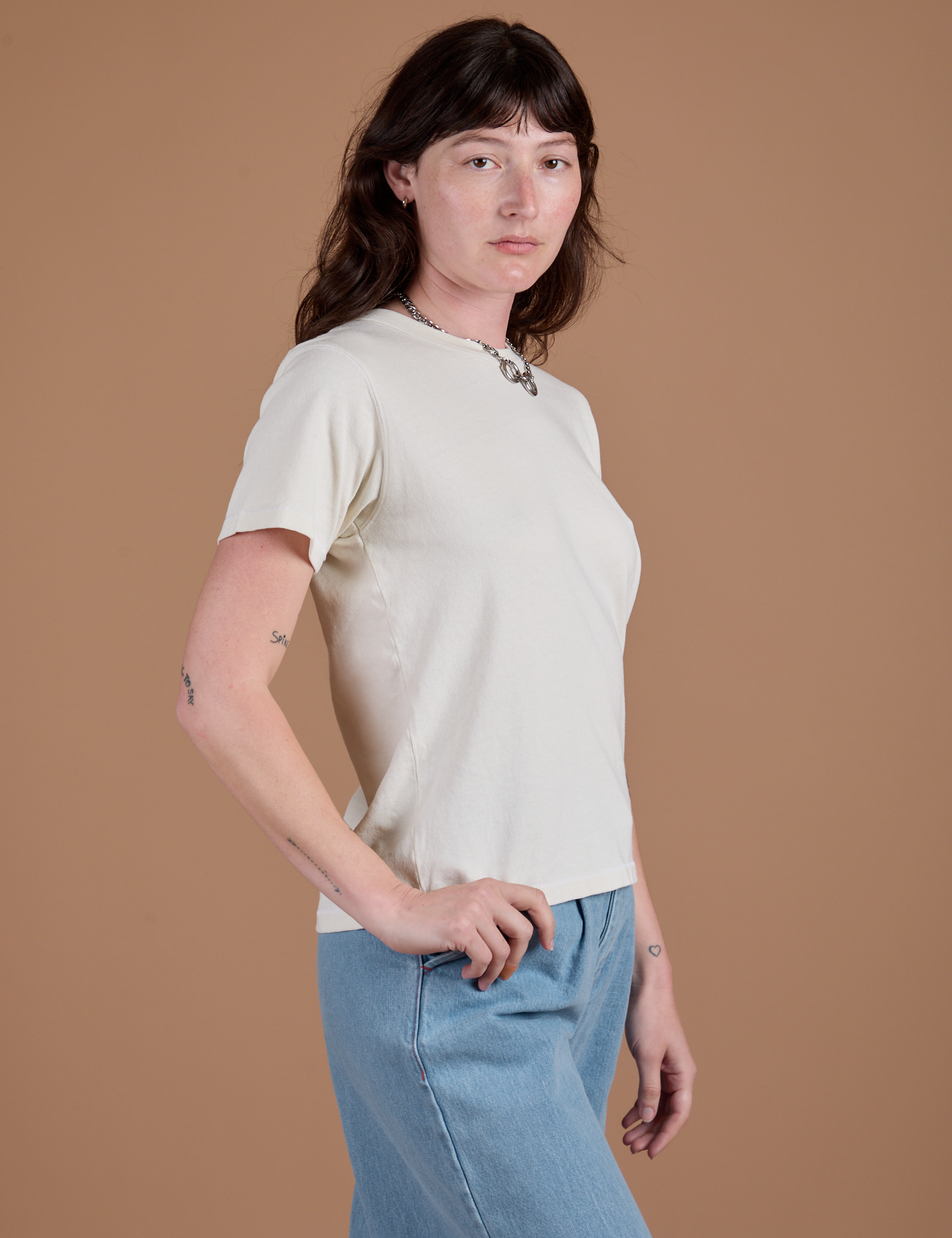 Angled front view of Burly Tee in Vintage Tee White on Alex