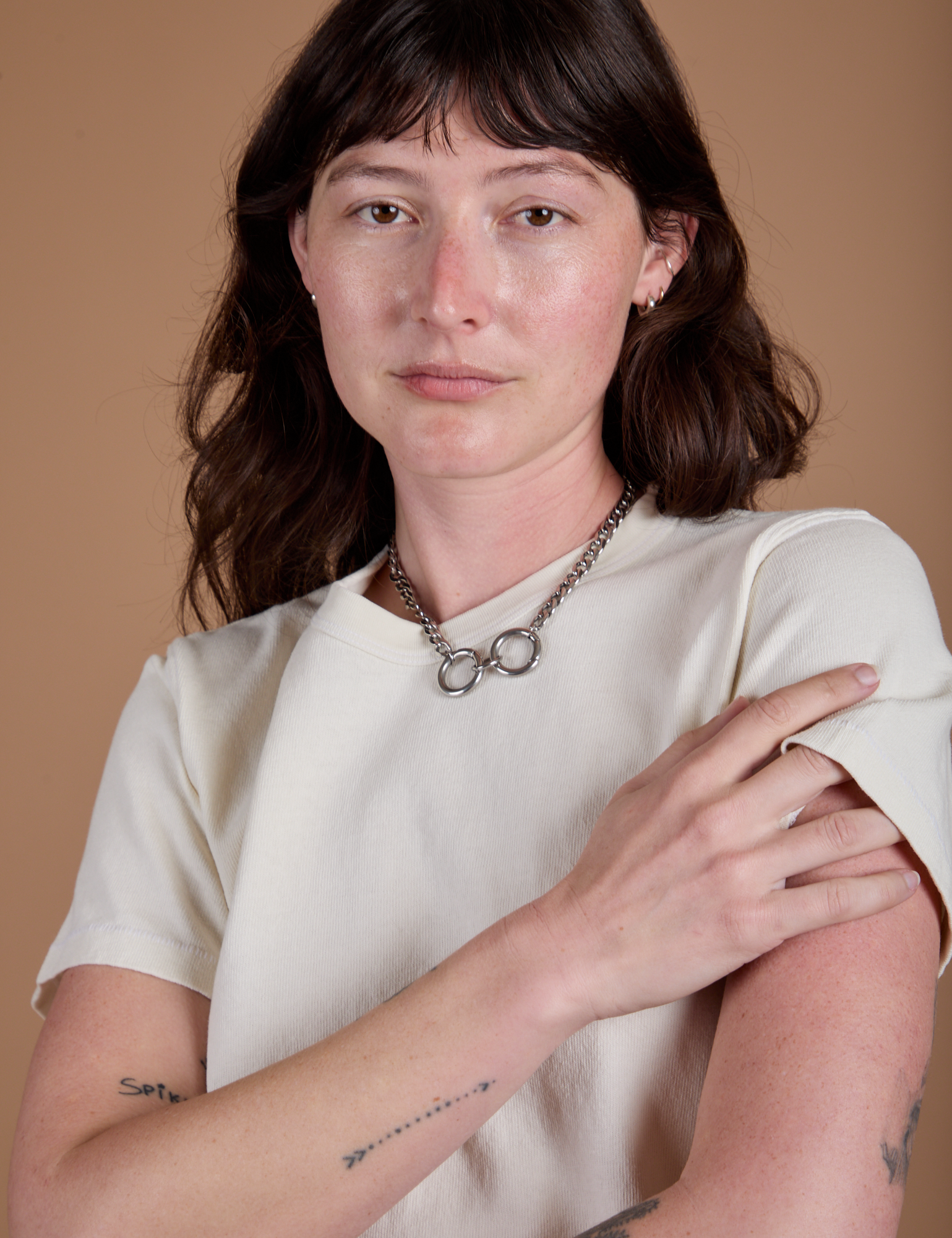 Burly Tee in Vintage Tee White front close up on Alex