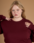 Close up of Juliet wearing the Red Wine Long Sleeve Burly Tee