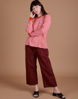 Alex is wearing Long Sleeve Burly Tee in Red/White Stripe and red wine Drop Pocket Cargo Pants