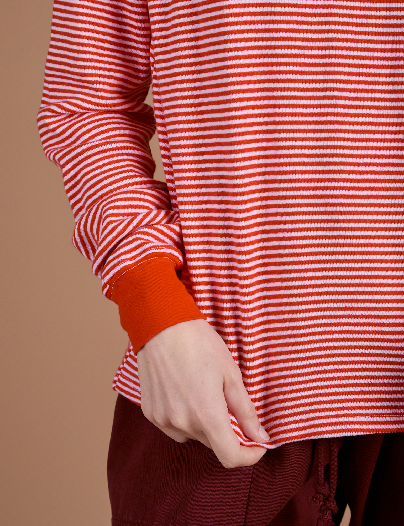 Long Sleeve Burly Tee in Red/White Stripe close up on Alex