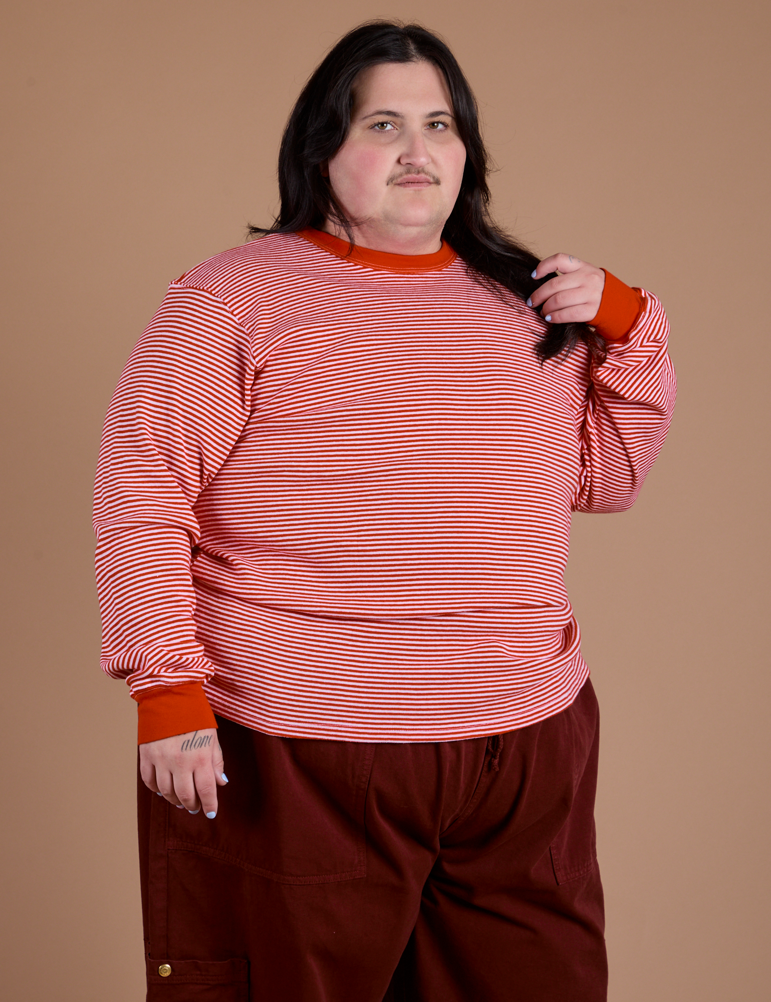 Sam is 5'9" and wearing L  Long Sleeve Burly Tee in Red/White Stripe