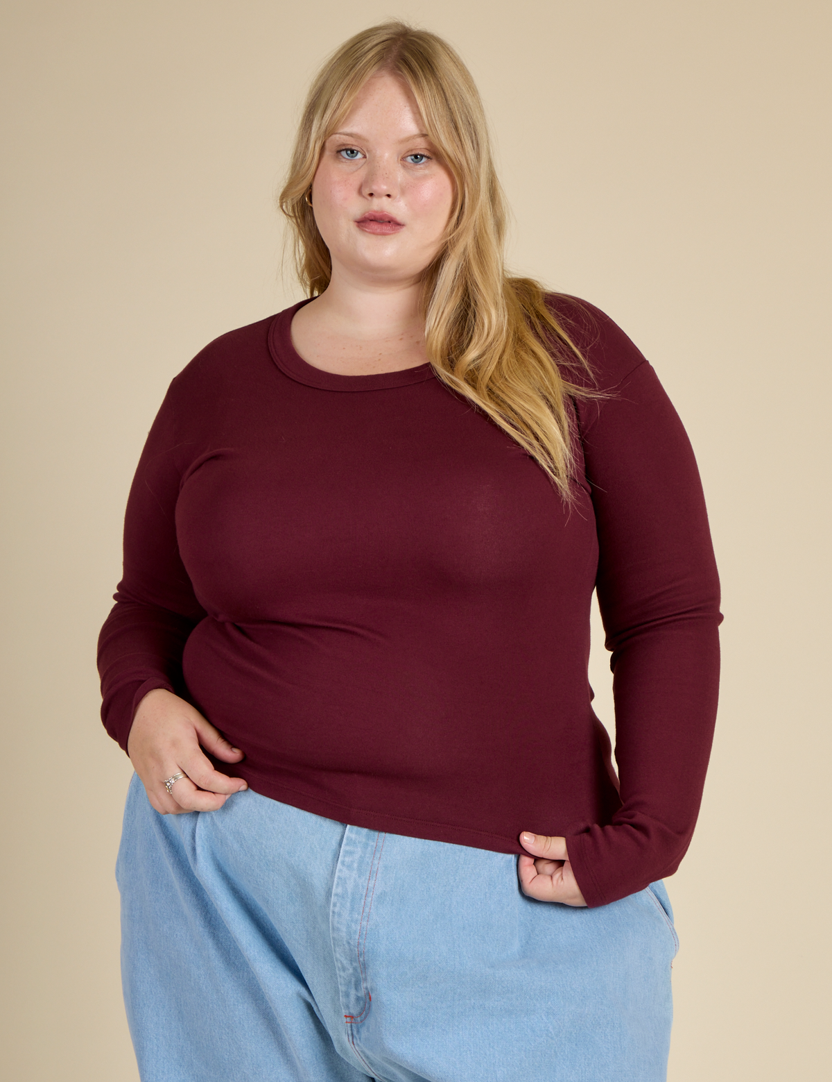 Juliet is 5'7" and wearing L Red Wine Long Sleeve Baby Tee