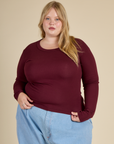 Juliet is 5'7" and wearing L Red Wine Long Sleeve Baby Tee