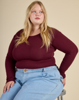 Juliet wearing the Red wine Long Sleeve Baby Tee