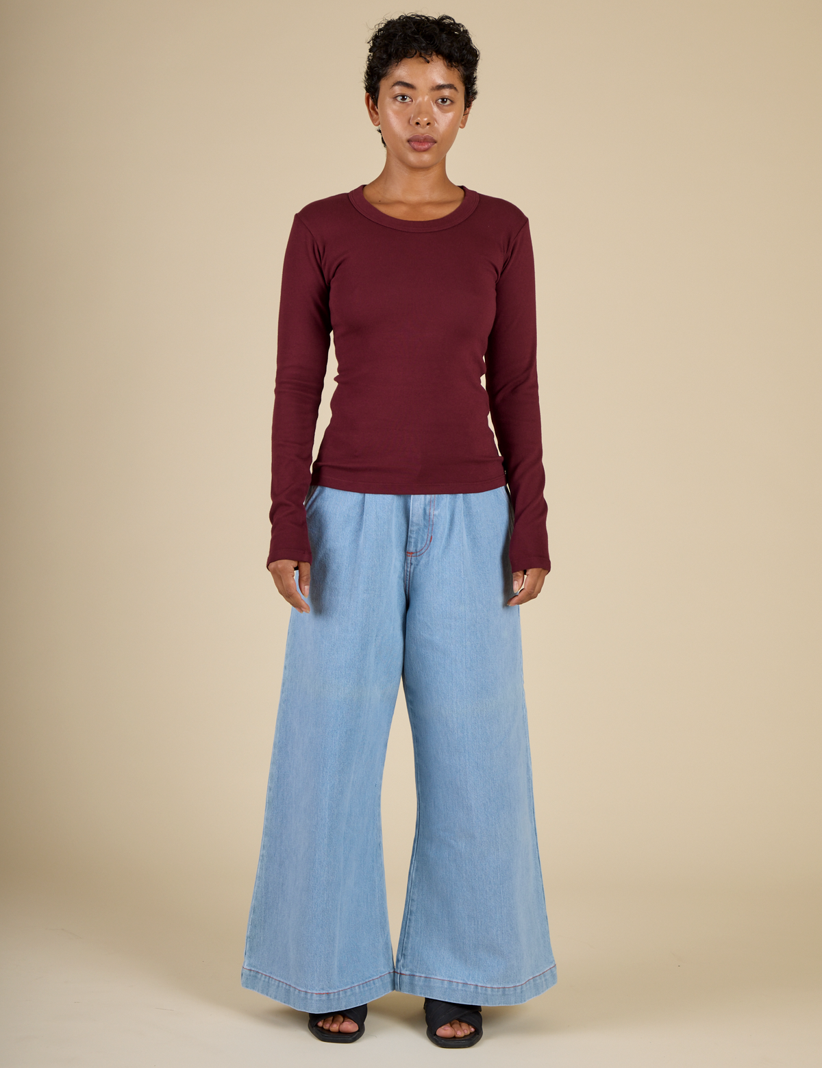 Mika is 5'3" and wearing P Red wine Long Sleeve Baby Tee with Petite Light Wash Denim Wide Leg Trousers 