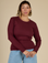 Tiara is 5'4" and wearing XS Red Wine Long Sleeve Baby Tee