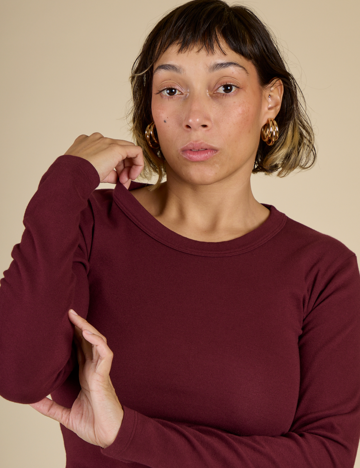 Close up of Tiara in the Red Wine Long Sleeve Baby Tee