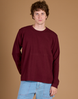 Quinn is 6'3" and wearing M Red Wine Long Sleeve Burly Tee