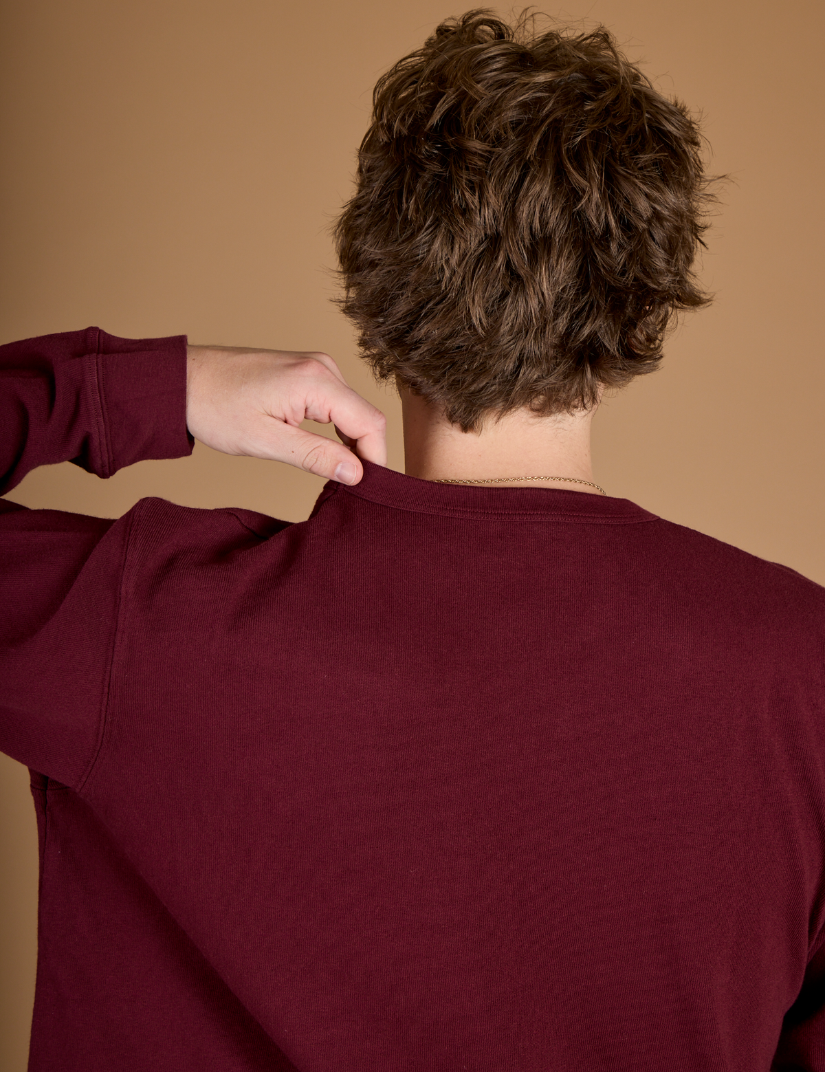 Back view of the Red Wine Long Sleeve Burly Tee on Quinn