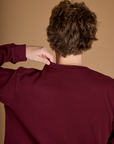 Back view of the Red Wine Long Sleeve Burly Tee on Quinn