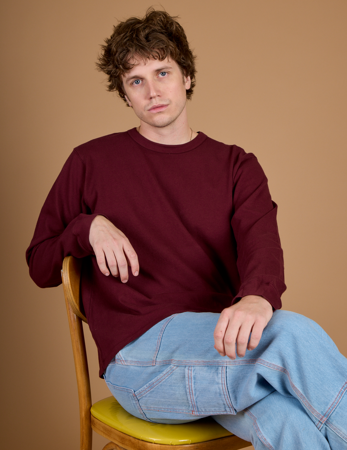Quinn wearing the Red Wine Long Sleeve Burly Tee