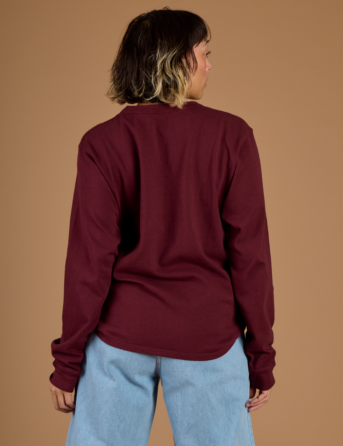 Back view of Tiara in the Red Wine Long Sleeve Burly Tee