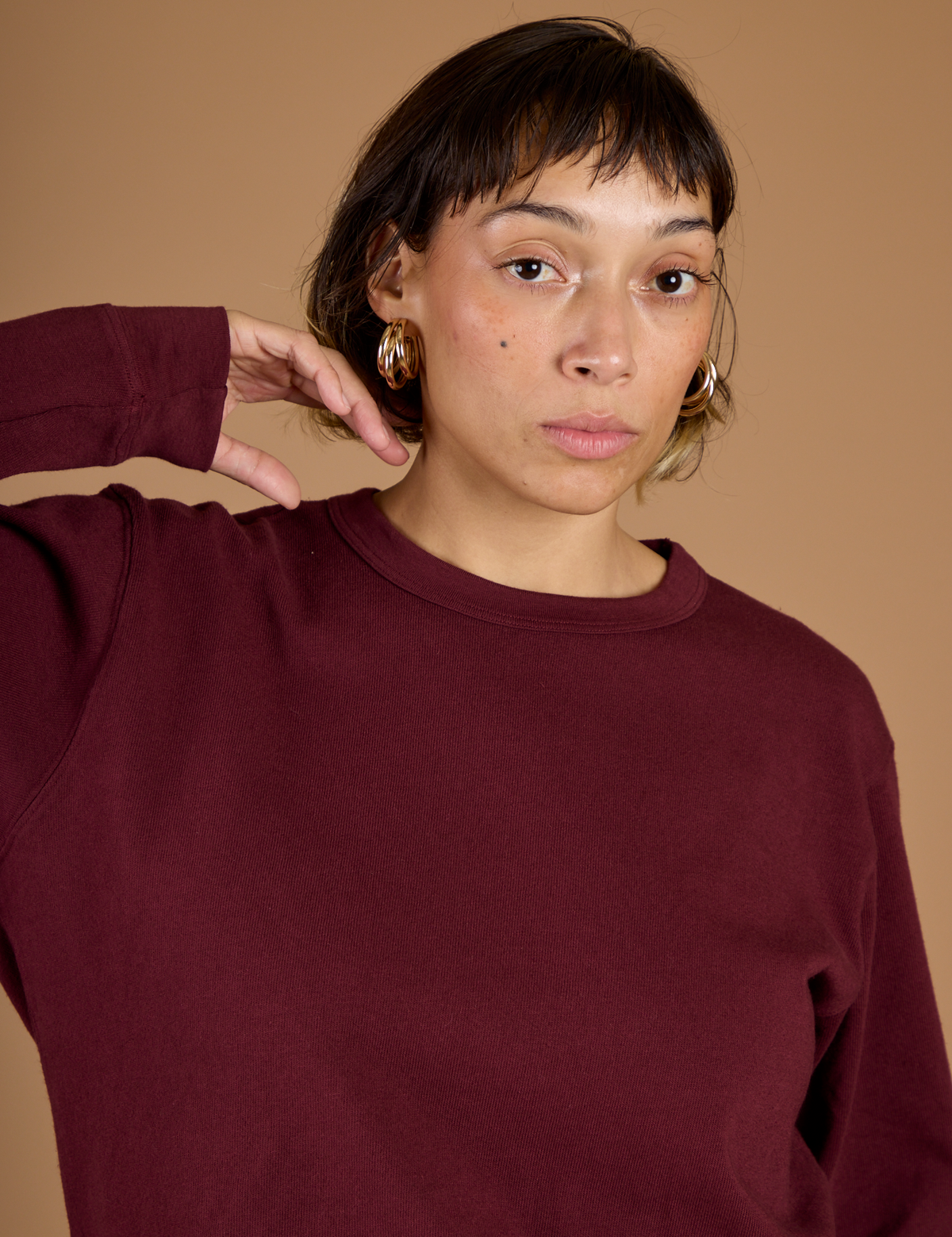 Close up of Tiara in the Red Wine Long Sleeve Burly Tee