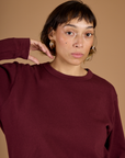 Close up of Tiara in the Red Wine Long Sleeve Burly Tee