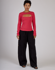 Mika is 5'3" and wearing P Hot Pink Long Sleeve Porthole Tee with Black Drop Pocket Pants