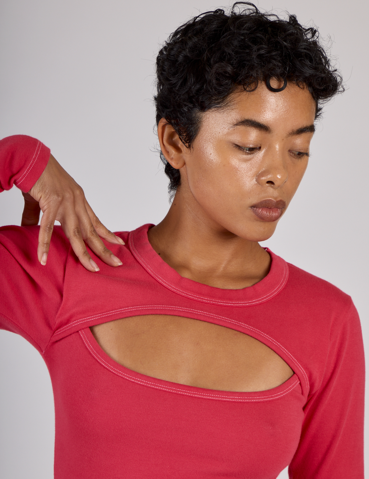 Close up of Mika wearing the Hot Pink Long Sleeve Porthole Tee
