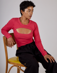Mika is 5'3" and wearing the Hot Pink Long Sleeve Porthole Tee with Black Drop Pocket Pants