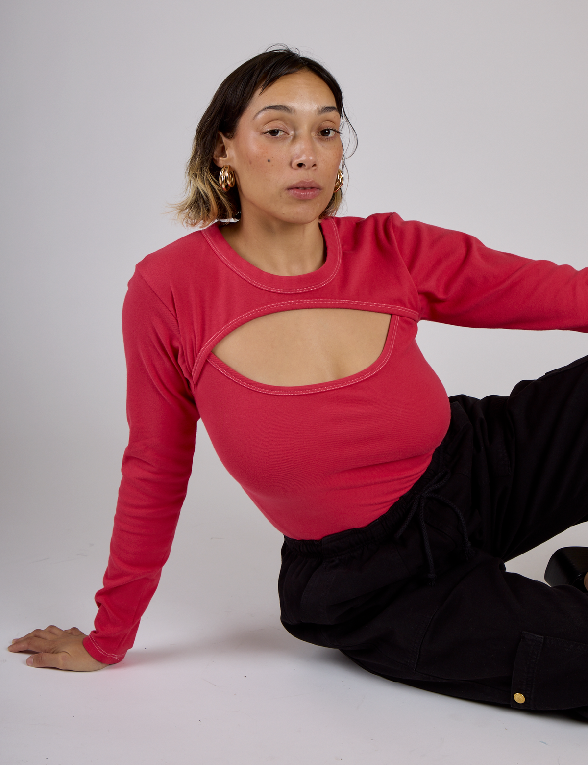 Tiara is wearing the Hot Pink Long Sleeve Porthole Tee