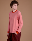 Angled front view of Long Sleeve Burly Tee in Red/White Stripe on Quinn