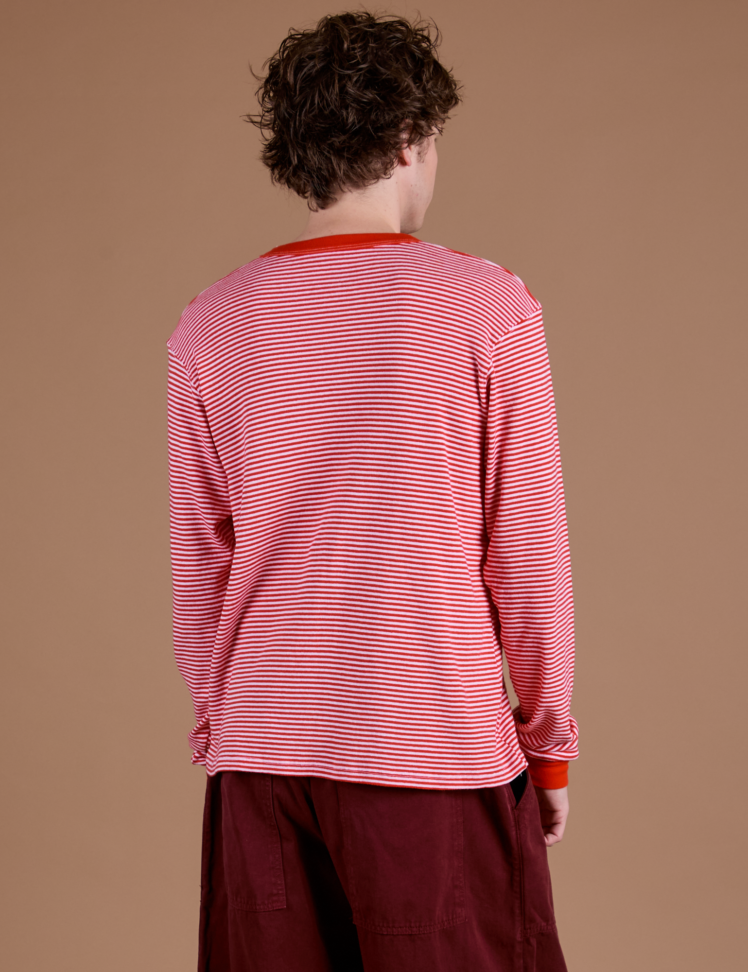 Long Sleeve Burly Tee in Red/White Stripe back view on Quinn