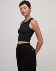 Angled side view of the Basic Black Deep Cut Racerback 