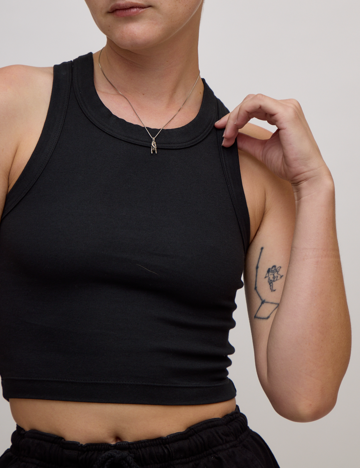Close up of the Basic Black Deep Cut Racerback  on Alex