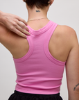 Close up back view of the P Bubblegum Pink Deep Cut Racerback on Alex