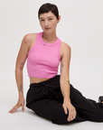 Alex is 5'8" and wearing P Bubblegum Pink Deep Cut Racerback