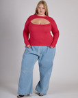 Juliet wearing the Hot Pink Long Sleeve Porthole Tee with Light Wash Wide Leg Denim Trousers
