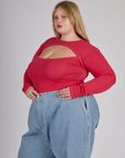 Angled side view of the Hot Pink Long Sleeve Porthole Tee worn by Juliet