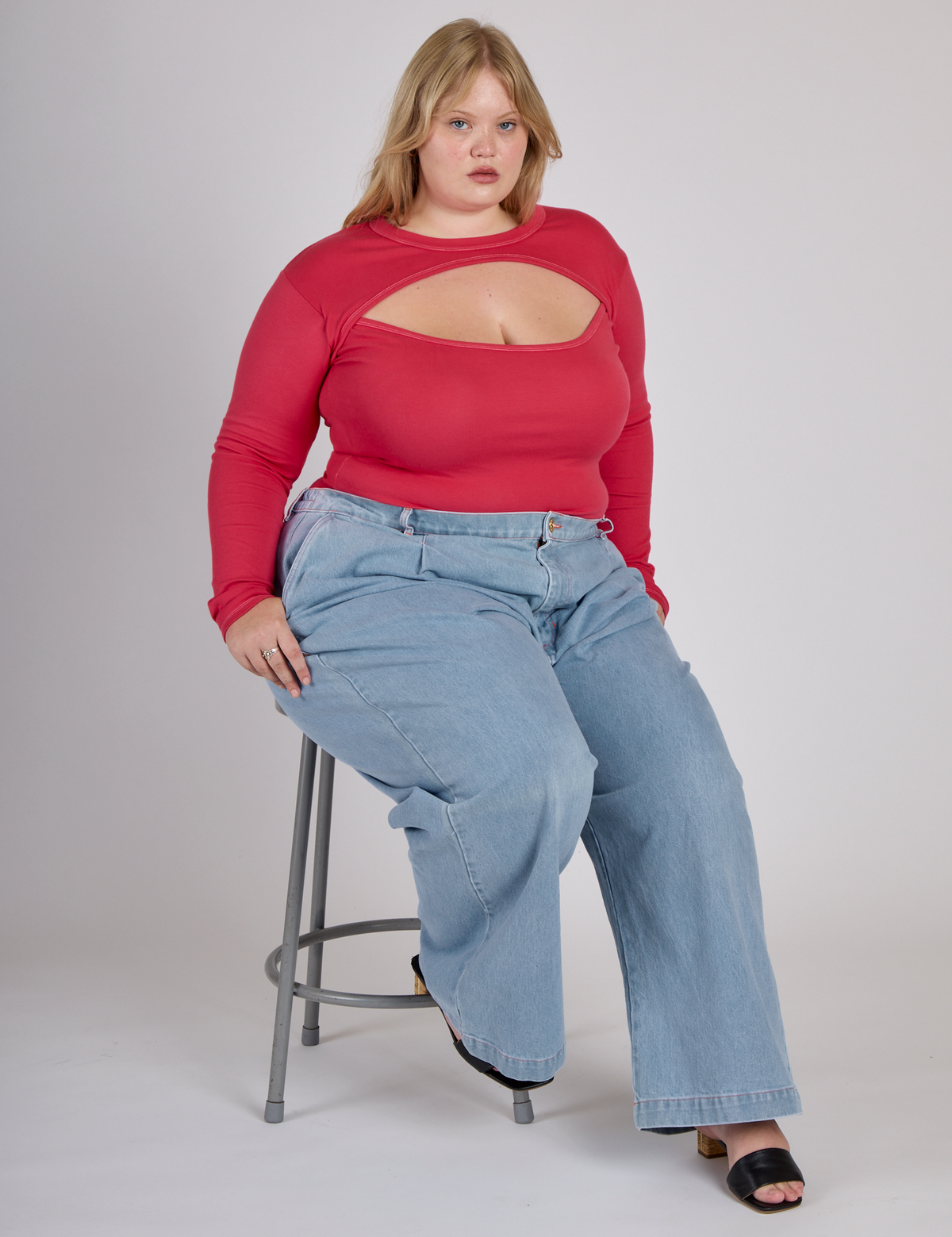 Juliet wearing the Hot Pink Long Sleeve Porthole Tee with Light Wash Wide Leg Denim Trousers