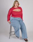 Juliet wearing the Hot Pink Long Sleeve Porthole Tee with Light Wash Wide Leg Denim Trousers