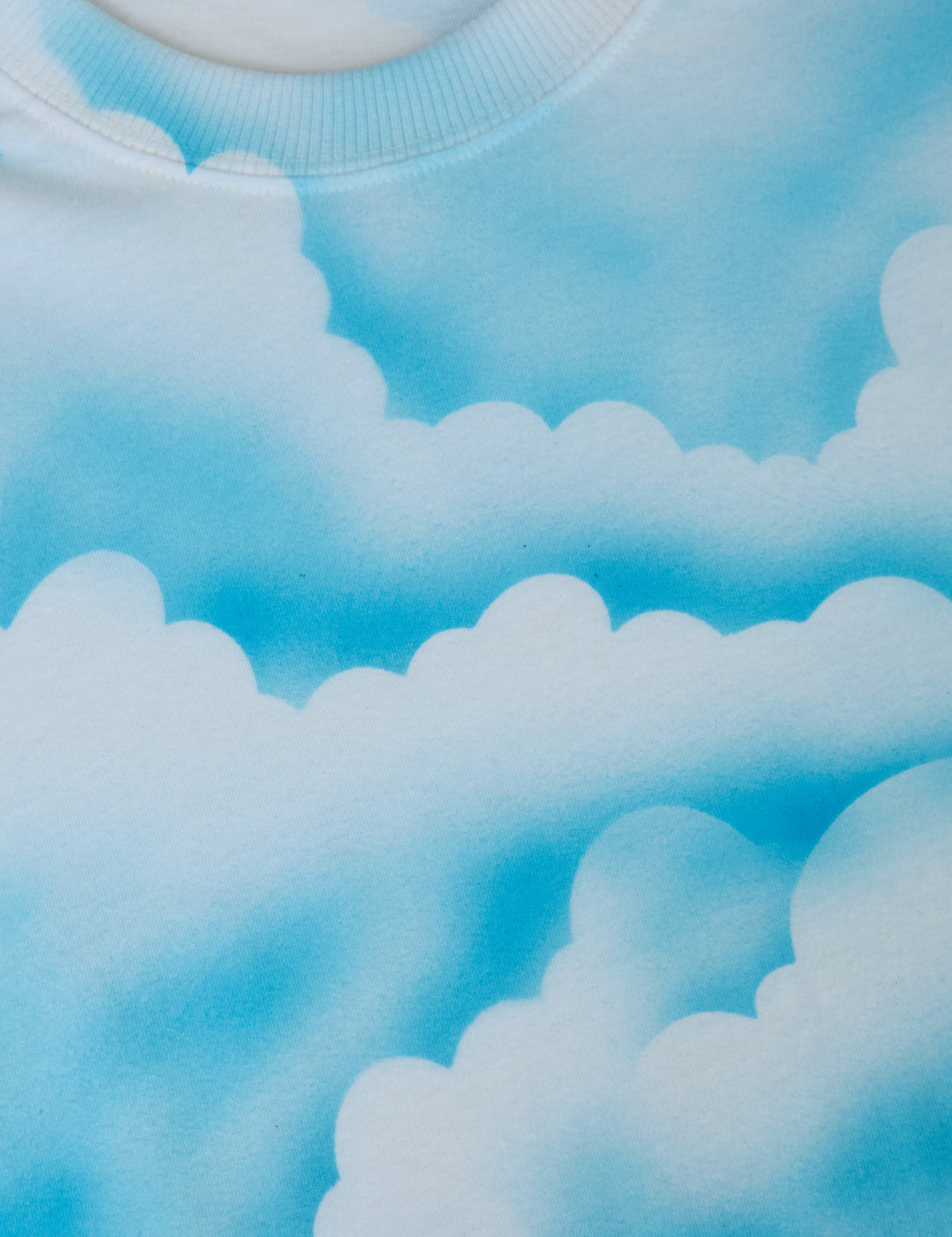 Fabric close up of the Cloud Coverage Airbrush Vintage Tee