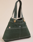 Angled view of Overall Handbag in Swamp Green