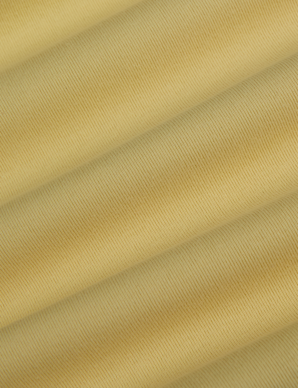 Fabric close up of the Butter Yellow Deep Cut Racerback