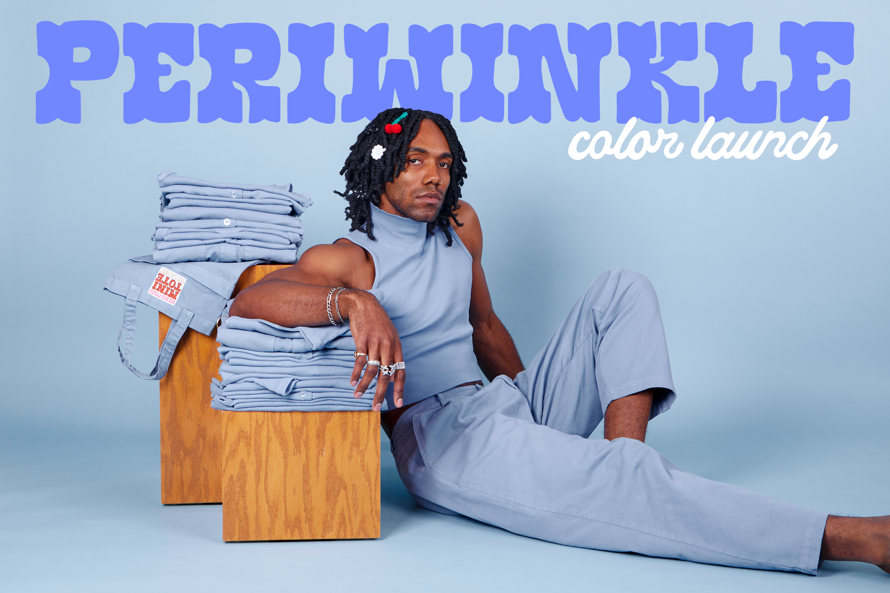 Jerrod is wearing Sleeveless Essential Turtleneck and Heavyweight Trousers in Periwinkle