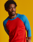 Isaac is 5'10" and wearing M Mustang Red/Blue Colorblock Raglan Tee