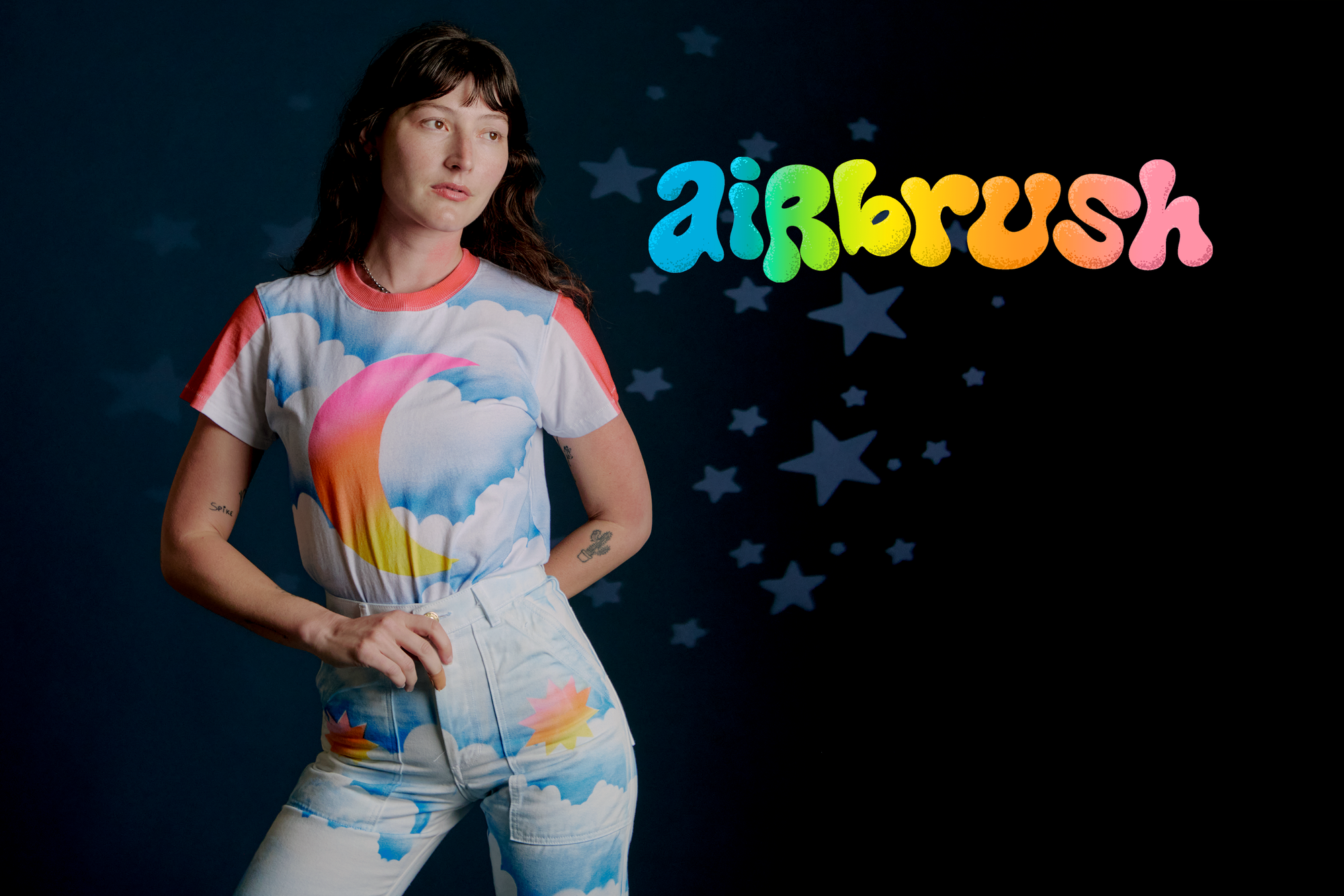 Alex is wearing Airbrush Moon Vintage Tee with Work Pants in Sunny Cloud Airbrush