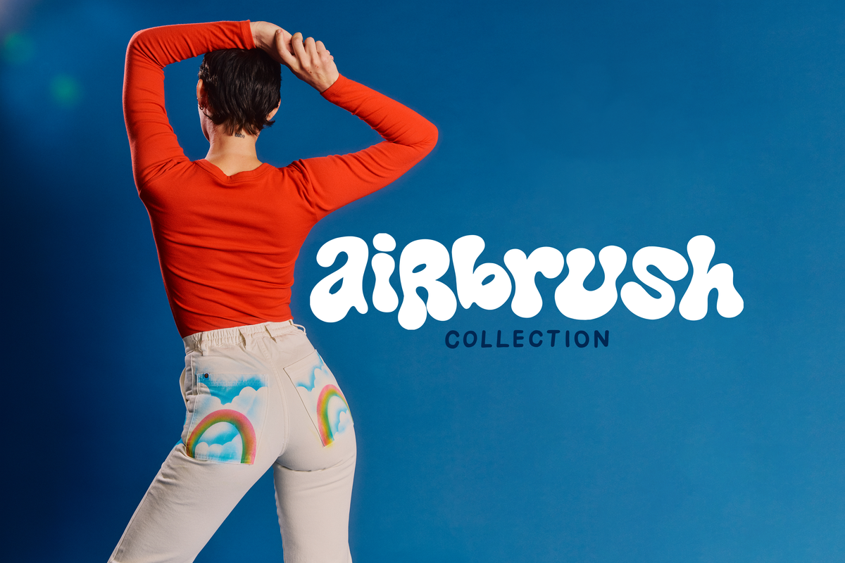 Back view of Alex wearing the Pockets of Sky Airbrush Work Pants with the Chili Red Long Sleeve Baby Tee