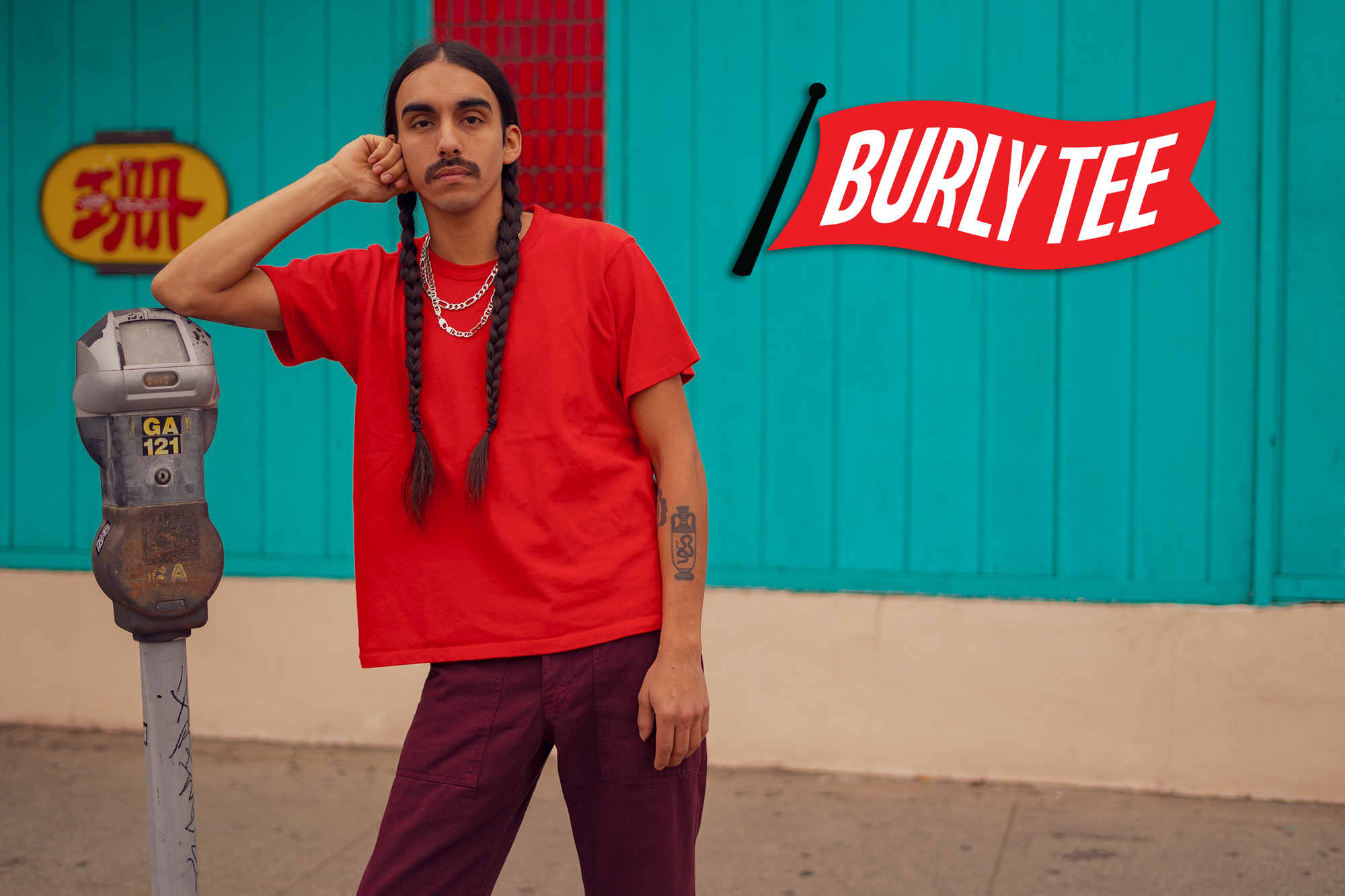 Anthony is wearing the Burly Tee in Mustang Red