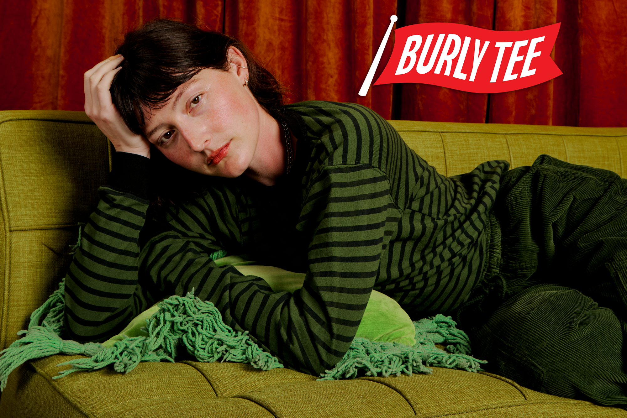 Alex is wearing the Long Sleeve Burly Tee in Evergreen/Black Stripe