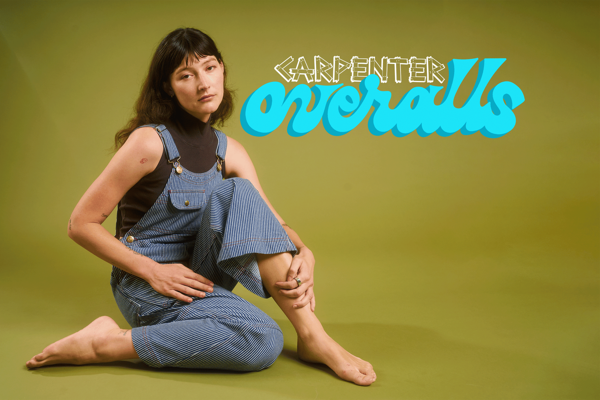 Alex is wearing Carpenter Overalls in Railroad
