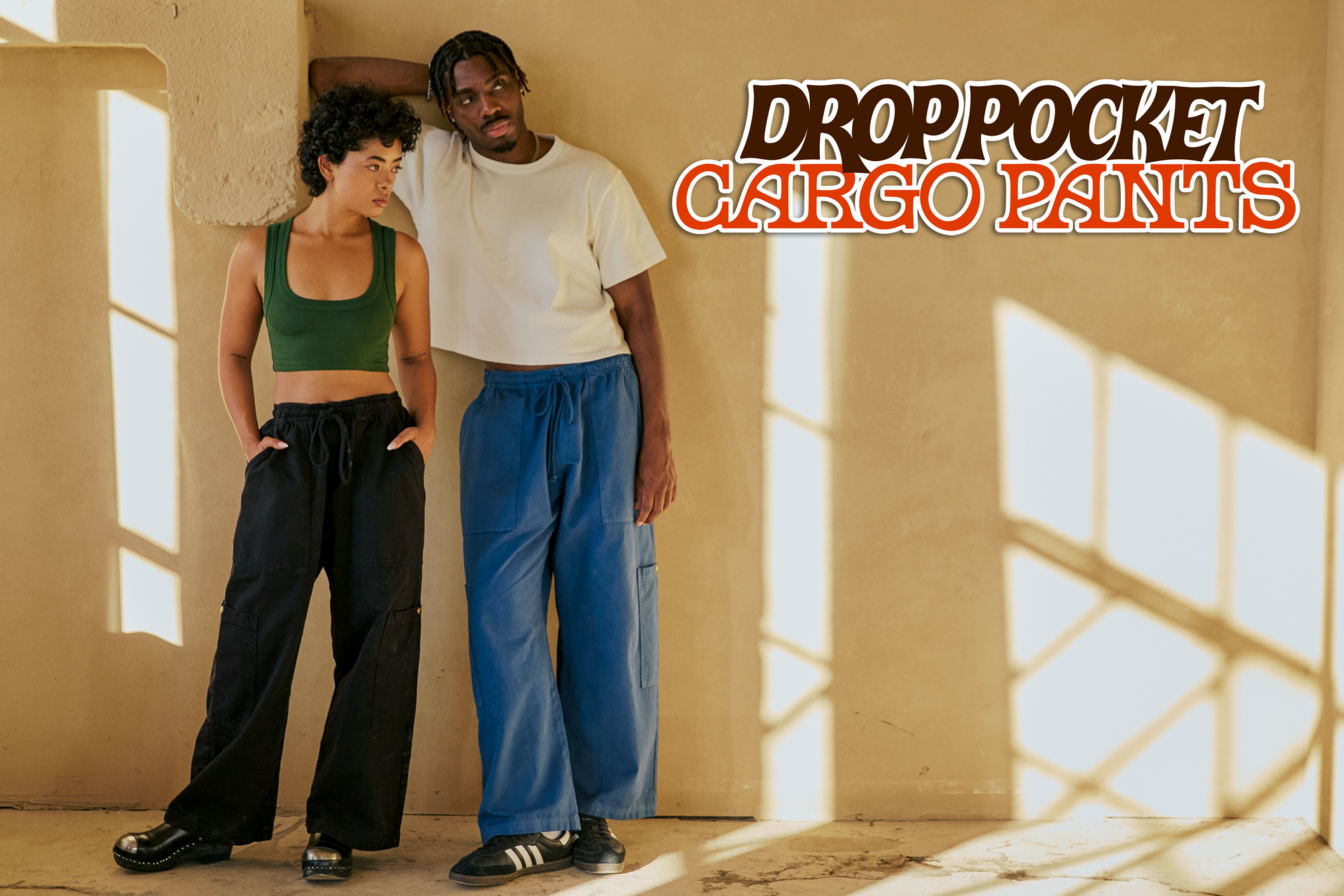 Mika is wearing black Drop Pocket Cargo Pants and Isaac is wearing French Blue