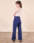 Back view of Western Pants in Navy paired with a vintage off-white Tank Top worn by Hana